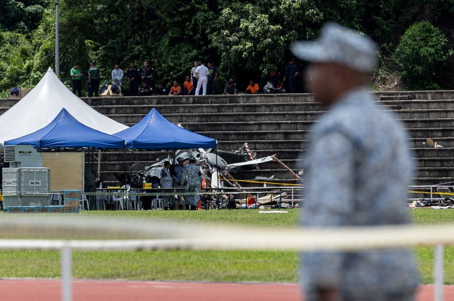 One of the wreckages of the helicopter is seen at the Navy Stadium in Lumut. - BERNAMA PIC