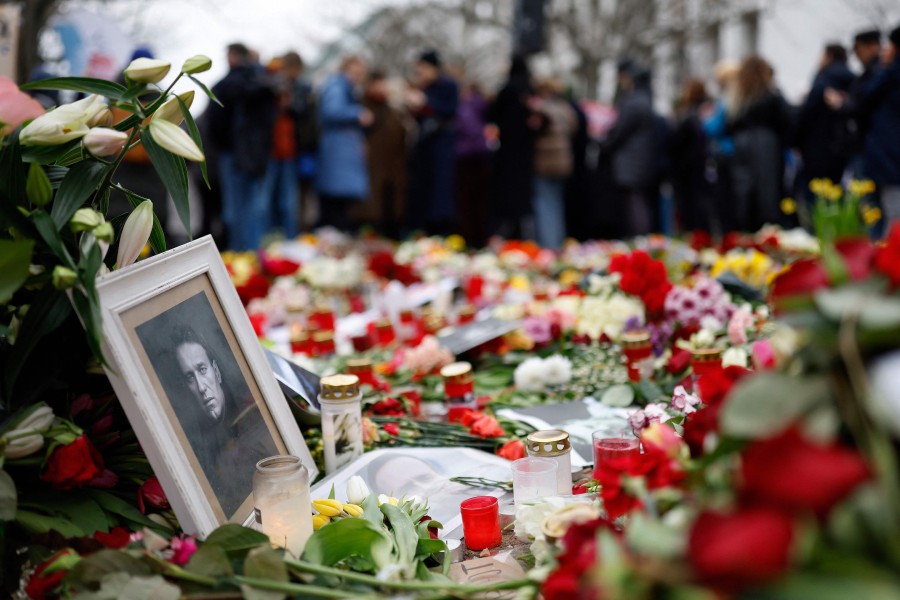 People lay flowers and candles at a memorial in front of the Russian embassy in Berlin, following the death of the Kremlin's most prominent critic Alexei Navalny in an Arctic prison. -AFP PIC