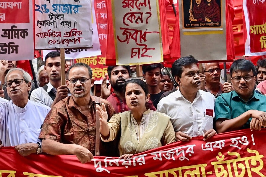 Garment workers and activists take part in a protest in Dhaka. - AFP PIC
