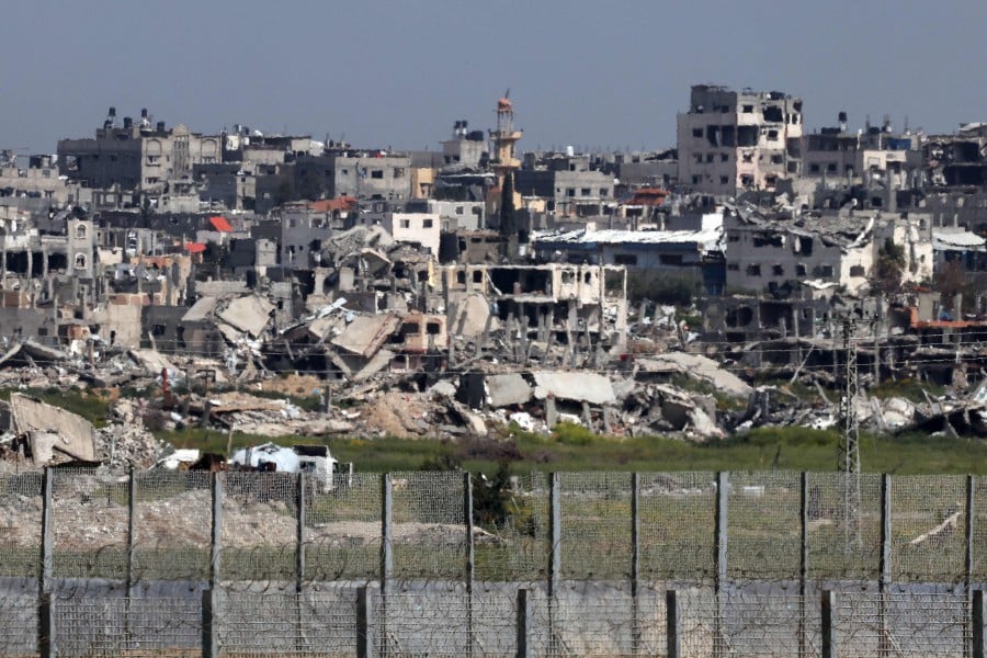 This picture taken on March 28, 2024 from Israel's southern border with the Gaza Strip shows buildings which have been destroyed by Israeli strikes. - AFP PIC