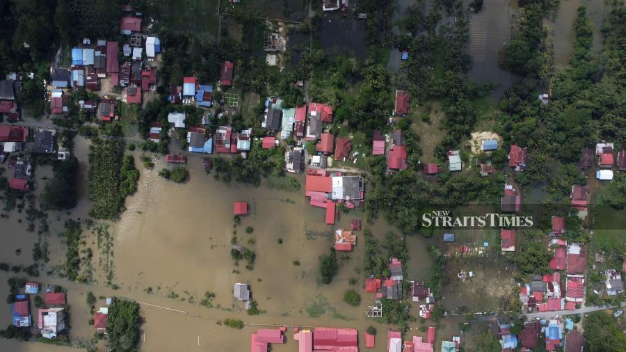 An aerial view of floods in Kampung Kajang Sebidang, Kubang Sawa and Bendang Pak Yong following heavy rain in Tumpat. -NSTP/NIK ABDULLAH NIK OMAR