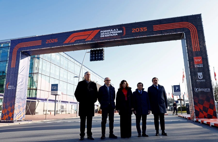 Formula One group CEO Stefano Domenciali, Community of Madrid president Isabel Diaz Ayuso, Mayor of Madrid Jose Luis-Martinez-Almeida, IFEMA Madrid president Jose Vicente de los Mozos, and Madrid Chamber of Commerce president Angel Asensio pose for a photograph during the Formula One host event in Madrid at the IFEMA Fairgrounds, Madrid. - REUTERS PIC