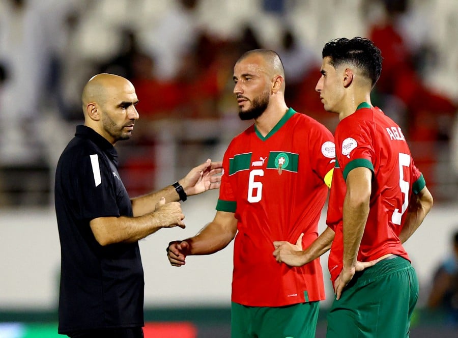 Morocco coach Walid Regragui, Romain Saiss and Nayef Aguerd look dejected after the match. - REUTERS PIC