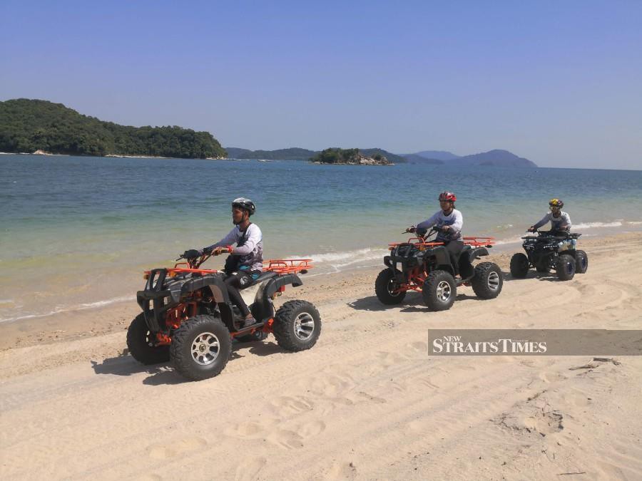 Enjoy an exhilirating ATV ride by the beach.