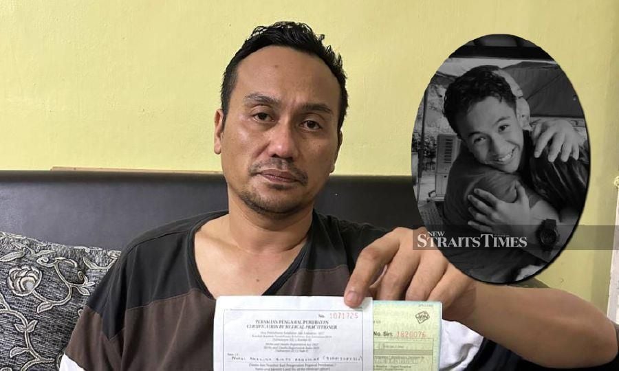 Syahrol Azmi Mohd Hekak holding the death certificate of his son -  Airiel Syahren Syahrol (inset). 