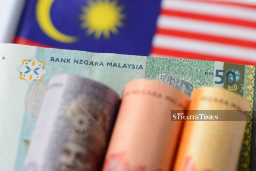 The ringgit opened easier against the US dollar today as investors continued to favour safe haven currencies in light of the current cautious economic outlook, an economist said. NSTP/FILEPIC