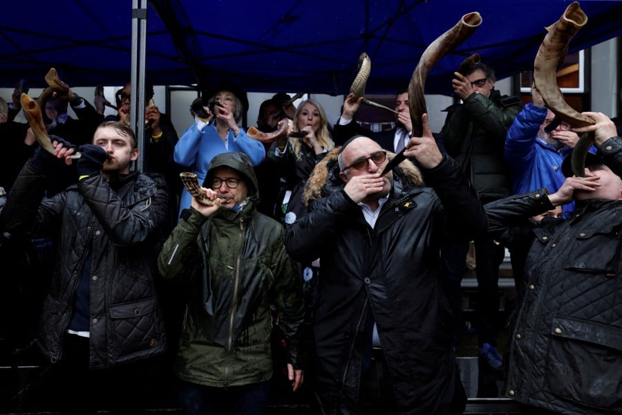 Members of the Jewish community and supporters blow shofars, in solidarity with the victims of the October 7th attack and the more that 100 hostages still being held, during the 'Blow for Hostages' event at St Johns Wood United Synagogue, in St John's Wood, London. - REUTERS PIC