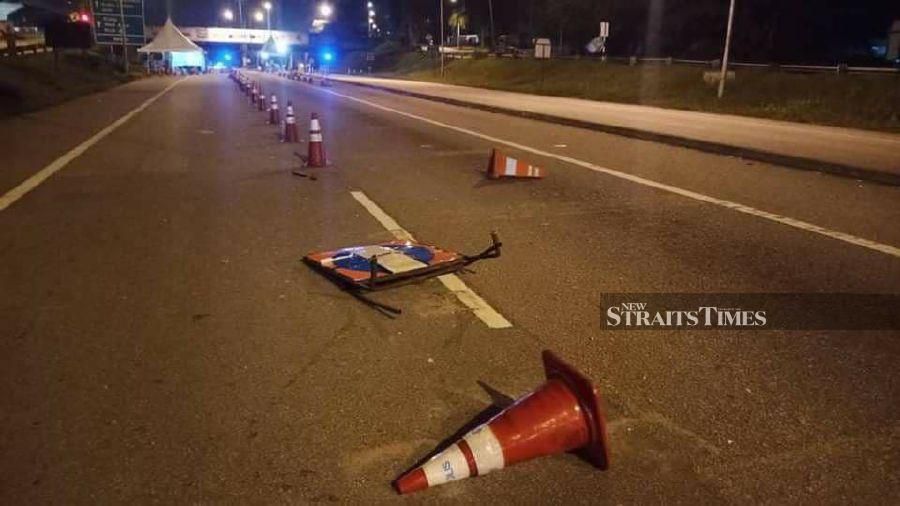 Some of the equipment set up for the roadblock were damaged, including signages, blue lights and road safety cones. - Photo courtesy of police.