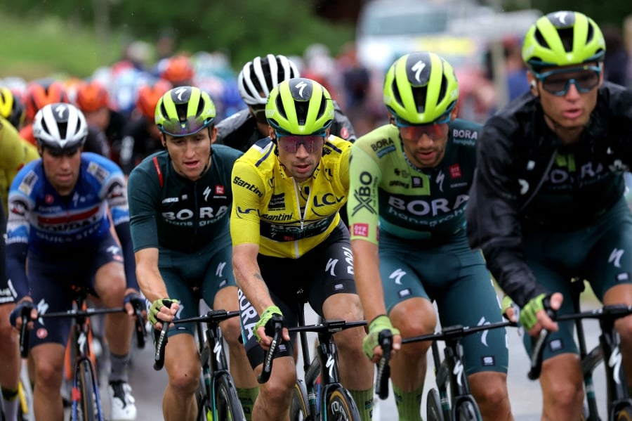 Primoz Roglic wearing the overall leader’s yellow jersey cycles with the peloton during Saturday’s seventh stage of the Criterium du Dauphine between Albertville and Samoens 1600 in the French Alps. - AFP PIC