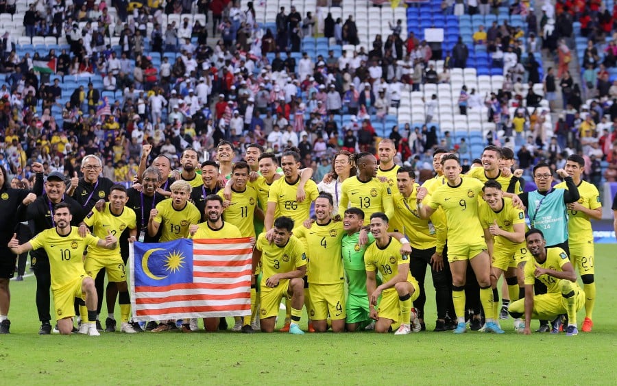 The Harimau Malaya team poses for a photo after a 3-3 draw against South Korea during the final action in Group E in conjunction with the Qatar 2023 Asian Cup at Al Janoub Stadium, Doha. - NSTP/HAIRUL ANUAR RAHIM