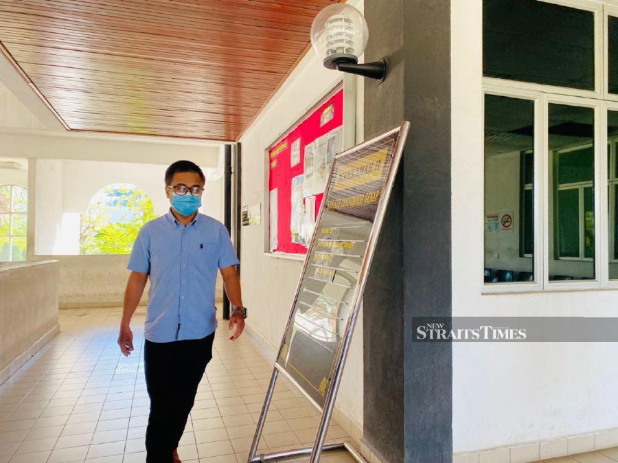 Rommy Ma'i'aruf, 41, clad in a blue shirt, was calm when Magistrate Sri Pracha Nanthini Balabedha handed down the sentence. - NSTP NUR IZZATI MOHAMAD.
