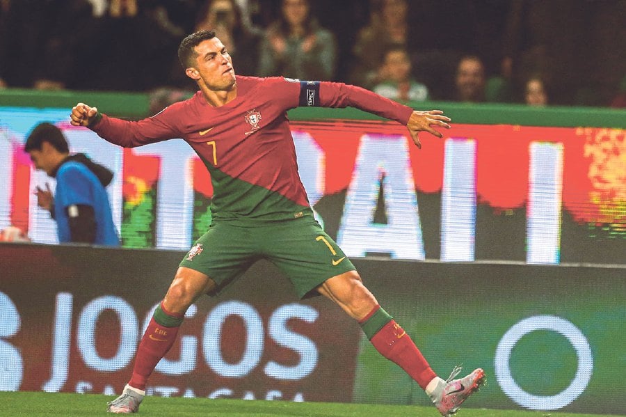 Portugal's forward Cristiano Ronaldo celebrates scoring his team's fourth goal during the UEFA Euro 2024 qualification match between Portugal and Liechtenstein at the Jose Alvalade stadium in Lisbon on March 23, 2023. - AFP PIC