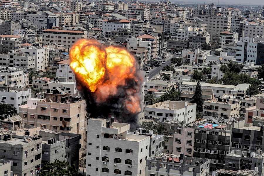  A fireball erupts as a result of an Israeli air strike on a building in Gaza City on August 6, 2022. - AFP PIC