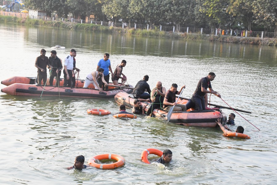 Rescuers look for survivors in Harni lake where a boat carrying children and teachers who were on a picnic capsized in Vadodara, India. - REUTERS PIC