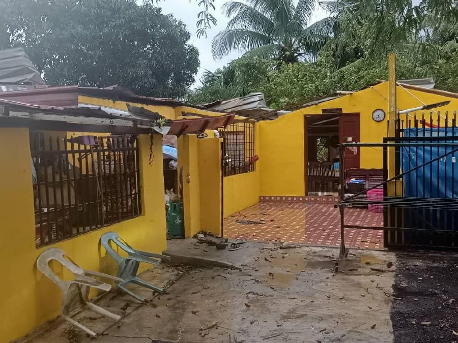 One of the houses in Kampung Teluk Wang Kechil, damaged by the storm. -- Pic courtesy of APM