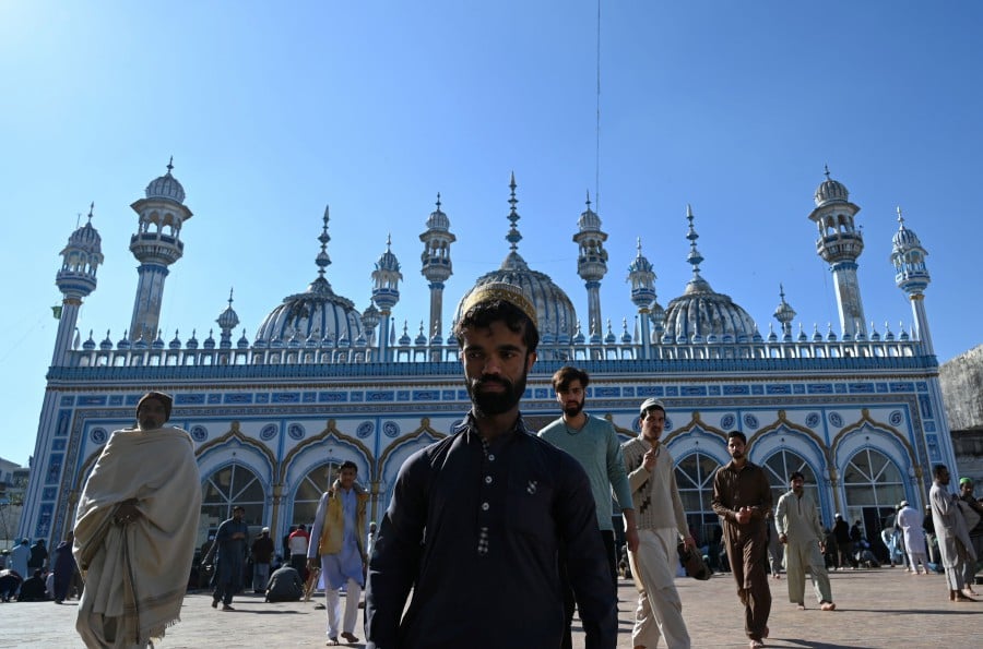 Rozi Khan who resembles US actor Peter Dinklage, leaving a mosque after Friday prayers in Rawalpindi. - AFP