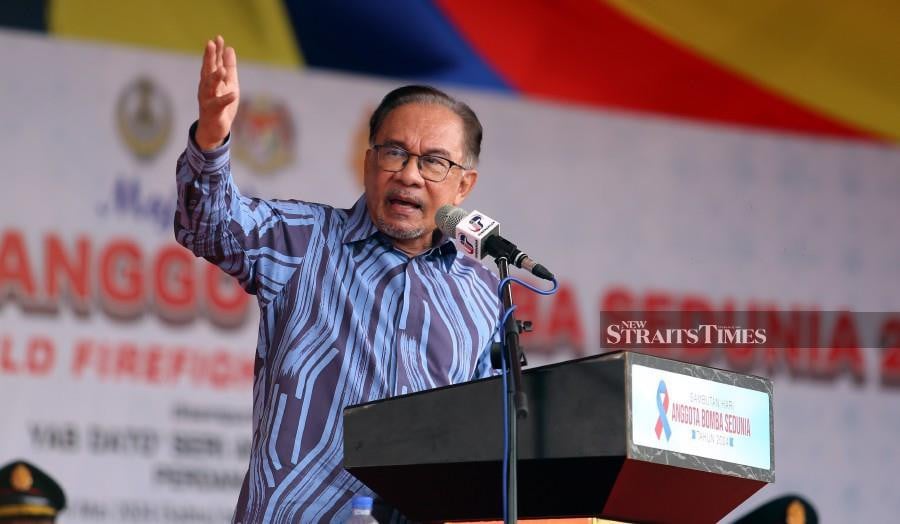 Prime Minister Datuk Seri Anwar Ibrahim delivers his keynote address during the International Firefighters’ Day 2024 celebration at Jalan Tambun, Sunway City, Ipoh. -NSTP/L. MANIMARAN