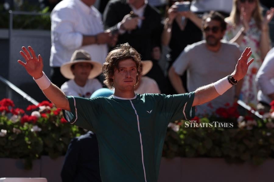 Andrey Rublev celebrates defeating Taylor Fritz during today’s Madrid Open semi-final match at Caja Magica in Madrid. - AFP PIC