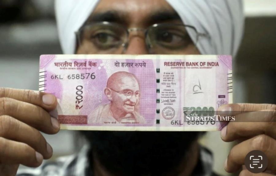 The Indian rupee fell on Monday on worries over a broader conflict in the Middle East but avoided slipping to a record low as the central bank possibly curbed losses, traders said.