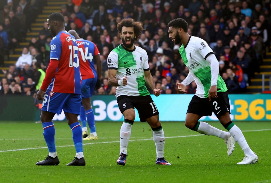 Liverpool's Mohamed Salah celebrates scoring their first goal against Crystal Palace at Selhurst Park, London. - REUTERS PIC