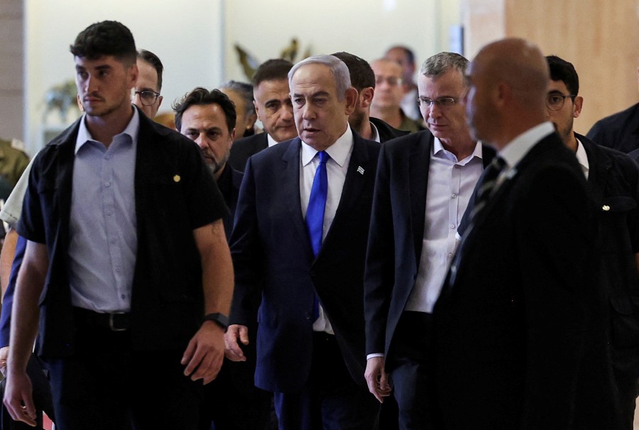 Israeli Prime Minister Benjamin Netanyahu arrives to his Likud party faction meeting at the Knesset, Israel's parliament, in Jerusalem. - AFP PIC