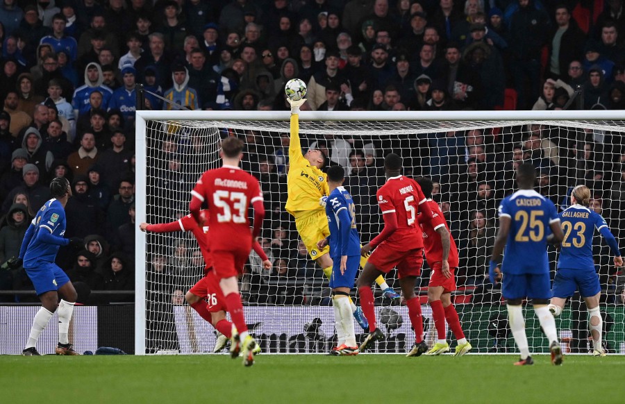 Chelsea's goalkeeper Djordje Petrovic saves a shot from Liverpool's English striker Jayden Danns (unseen) during the English League Cup final football match between Chelsea and Liverpool at Wembley stadium, in London. - AFP PIC