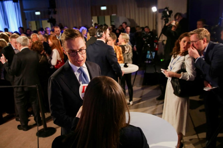 National Coalition Party (NCP) presidential candidate Alexander Stubb talks to the media ahead of the announcement of the results, at an election night event, in Helsinki, Finland. - REUTERS PIC