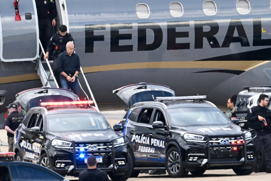 Counselor of the Rio de Janeiro Court of Audit Domingos Brazao walks down a Federal Police aircraft upon arrival in Brasilia, after being arrested in Rio de Janeiro, Brazil. - AFP PIC