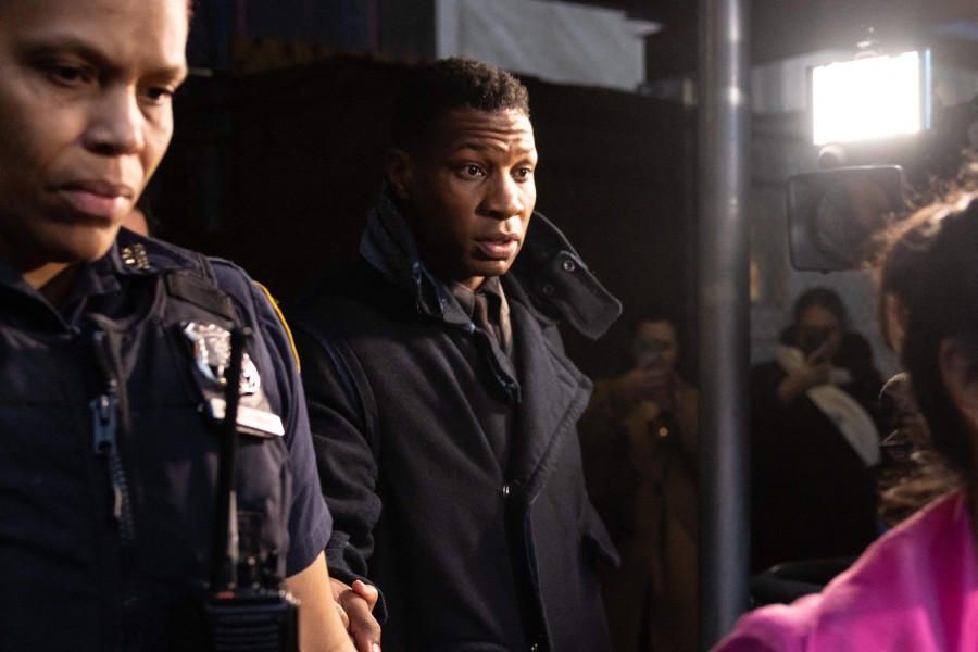 US actor Jonathan Majors (C) leaves a courtroom after being found guilty of assault and harassment of his former girlfriend, at the Manhattan criminal courts in New York City. - AFP PIC
