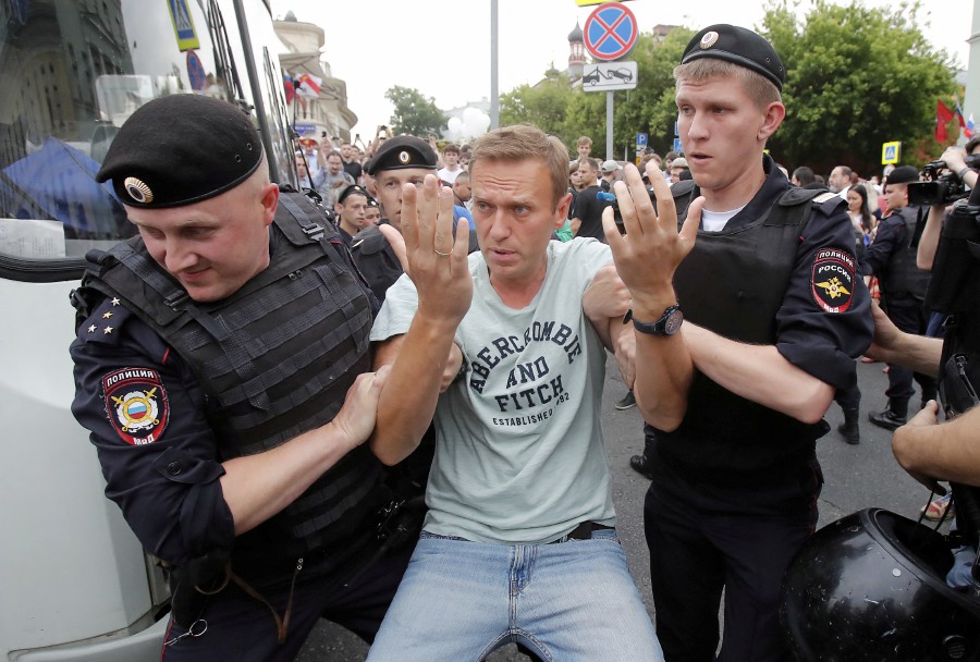 Policemen detain Russian opposition leader Alexei Navalny during a rally in support of investigative journalist Ivan Golunov, who was detained by police, accused of drug offences and later freed from house arrest, in Moscow, Russia June 12, 2019. --REUTERS PIC