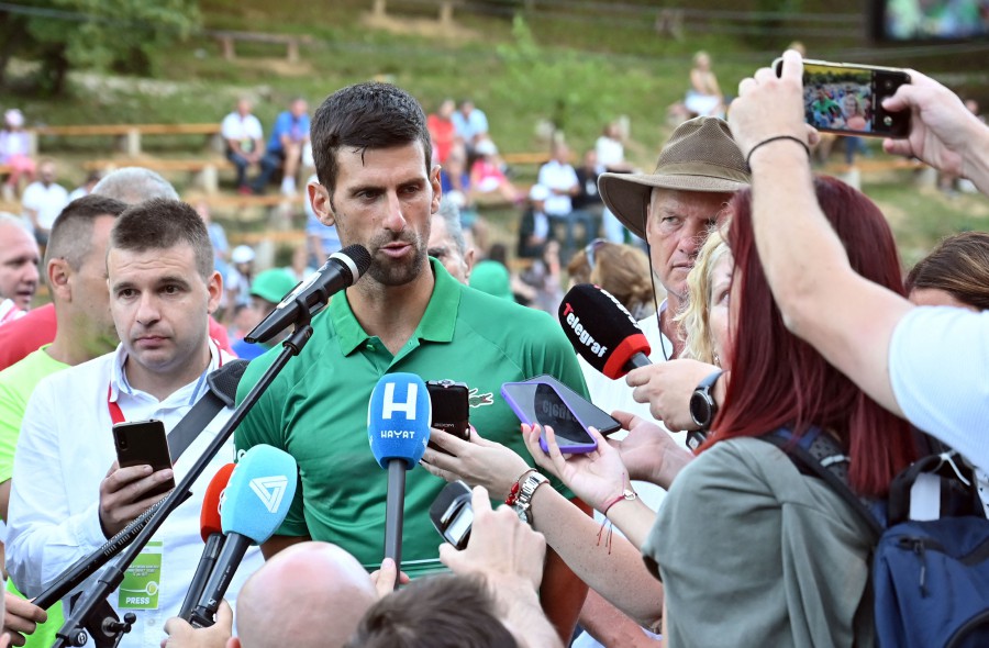 Serbian tennis player Novak Djokovic speaks to press after an exhibition match, organised to mark the opening of a tennis court at the "Archaeological park of the Bosnian pyramid" near Visoko, north of Sarajevo. - AFP PIC
