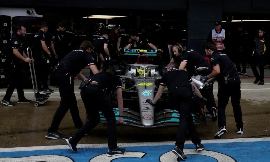 The car of British Formula One driver Lewis Hamilton of Mercedes-AMG Petronas is pushed back into the garage before the qualifying session of the Formula One Grand Prix of Britain at the Silverstone Circuit, Silverstone, Britain. - EPA PIC