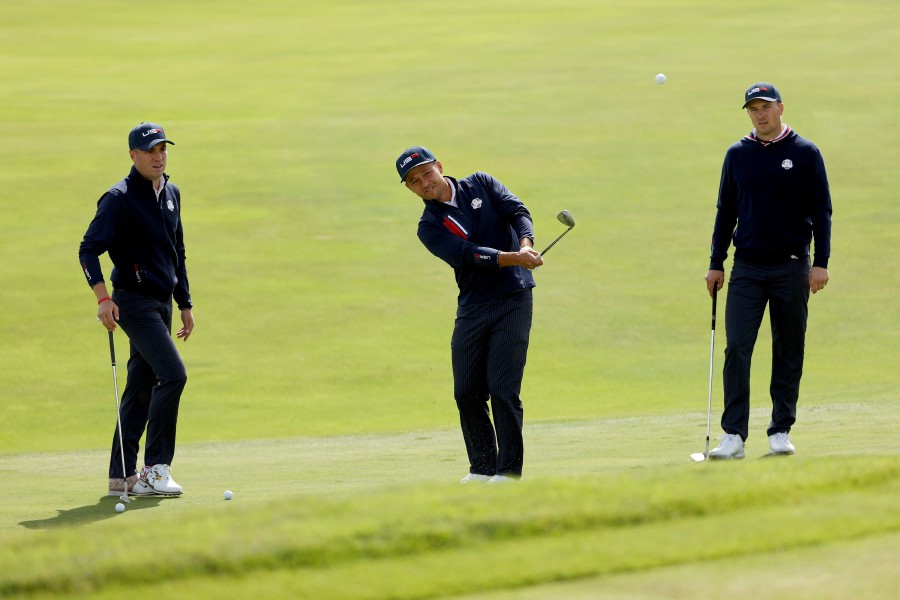Xander Schauffele of team United States plays a shot as Justin Thomas and Jordan Spieth look on during a practice round prior to the 43rd Ryder Cup at Whistling Straits in Kohler, Wisconsin. - AFP PIC
