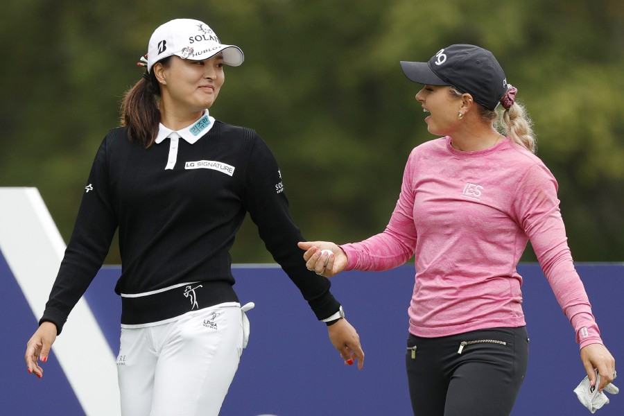 Ko Jin-young of Korea (L) talks with Lindsey Weaver of the United States (R) before hitting their tee shots on the 2nd hole during the third round of the Cognizant Founders Cup at Mountain Ridge Country Club in West Caldwell, New Jersey. -AFP PIC