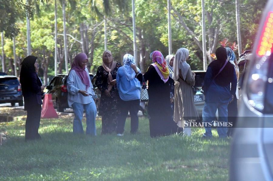 Family members and colleagues of the Royal Malaysian Navy 503 Squadron members who died in the mid-air collision of two helicopters at the Lumut naval base waiting at outside Terminal 2 of the Kota Kinabalu International Airport. Family members were later taken to the peninsula. NSTP/MOHD ADAM ARININ