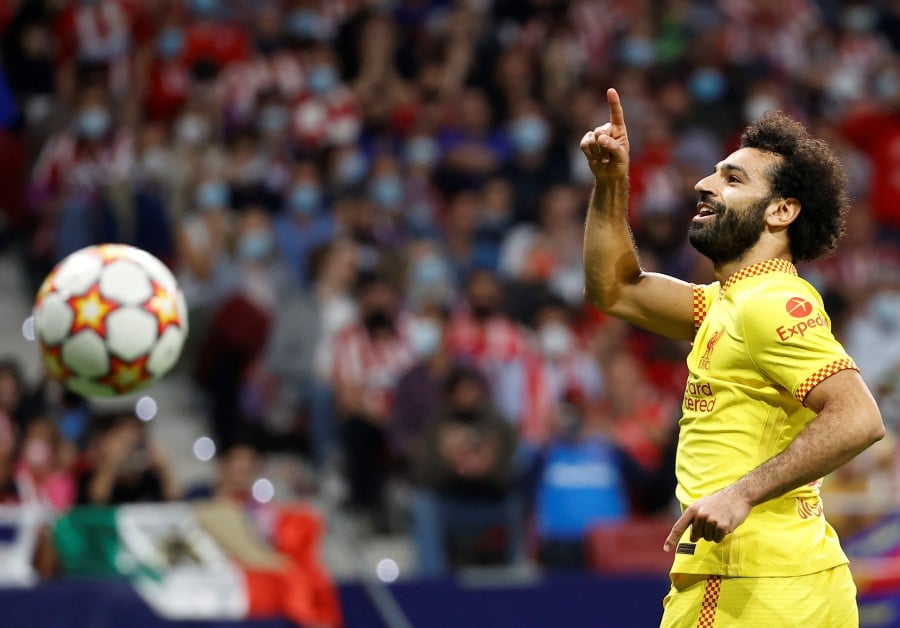 Liverpool's striker Mohamed Salah celebrates after scoring the 3-2 lead during the UEFA Champions League group B soccer match between Atletico Madrid and Liverpool FC at Wanda Metropolitano stadium in Madrid, Spain, 19 October 2021. EPA pic