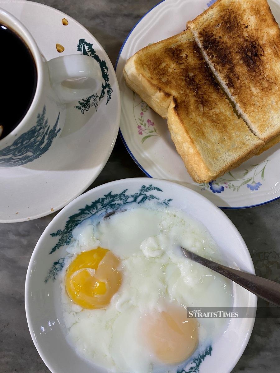 The all-day breakfast: the perfect half-boiled eggs goes, toasts and Kopi O.