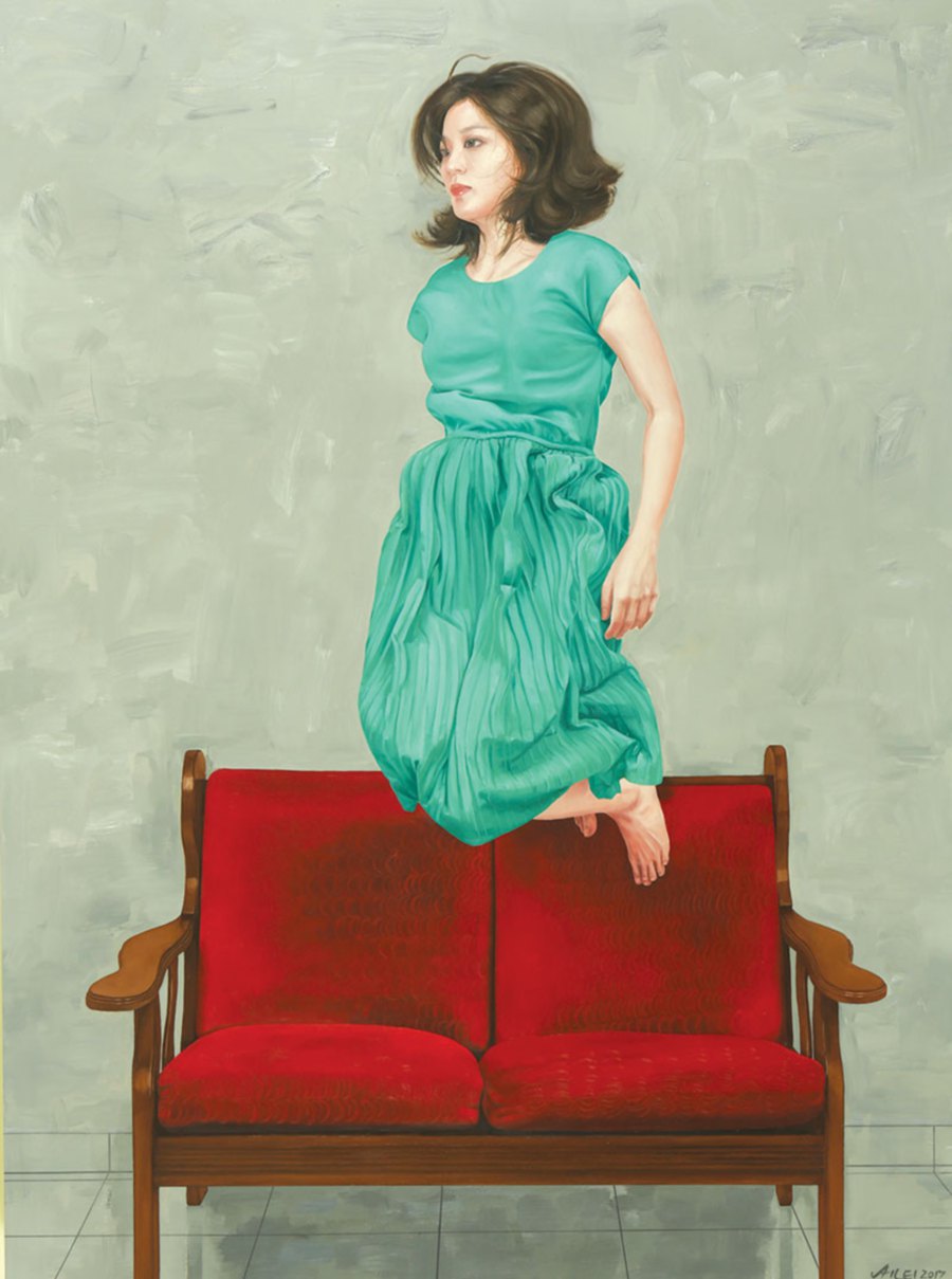 Girl Jumping On Red Sofa.