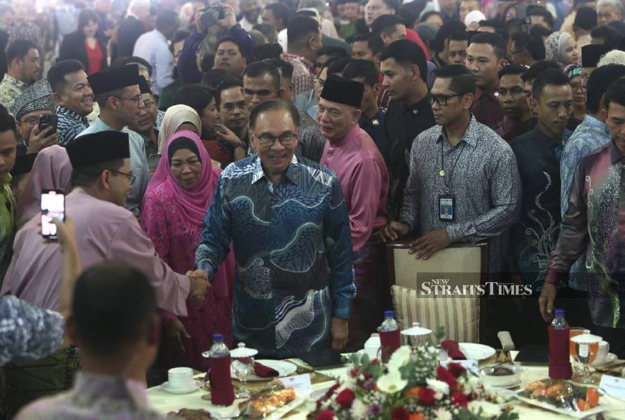 Prime Minister Datuk Seri Anwar Ibrahim being accompanied by Deputy Prime Minister Datuk Seri Fadillah Yusof at the latter’s Aidilfitri open house at Sri Satria, Putrajaya. PIC & VIDEO/MOHAMAD SHAHRIL BADRI SAALI