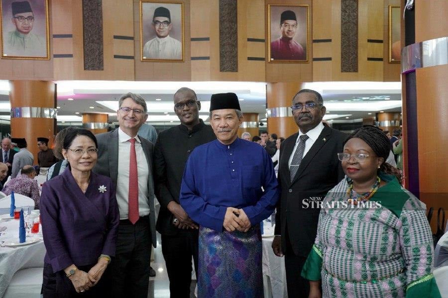 Foreign Minister Datuk Seri Mohamad Hasan (third from right) with some of the guests who attended the ministry’s Hari Raya Aidilfitri Celebration in Putrajaya today. NSTP/MOHD FADLI HAMZAH