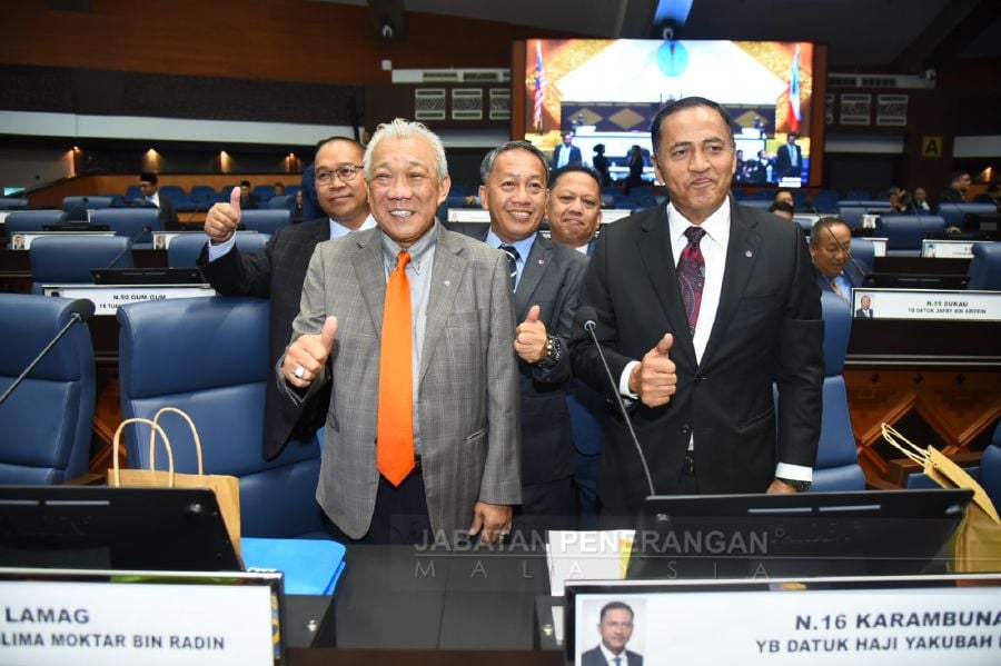 Sabah Umno chief Datuk Seri Bung Moktar Radin (left) gestures ahead of the state assembly sitting. - Pic courtesy of Sabah Information Department.