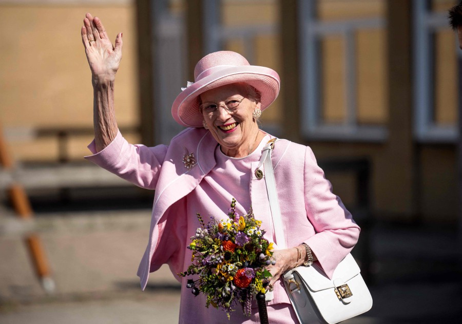  Queen Margrethe II of Denmark waves to onlookers as she visits Fredericia Municipality, Denmark, on September 1, 2023. - AFP PIC