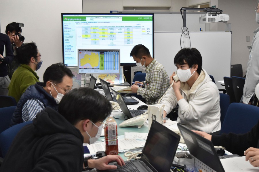 Government officials work at the disaster response headquarters in Fukushima Prefectural office. -AFP pic