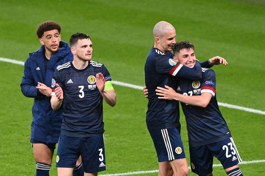 (From left) Scotland's Che Adams,  Andrew Robertson,  Lyndon Dykes and Billy Gilmour react after the UEFA EURO 2020 Group D football match between England and Scotland at Wembley Stadium in London. - AFP Pic
