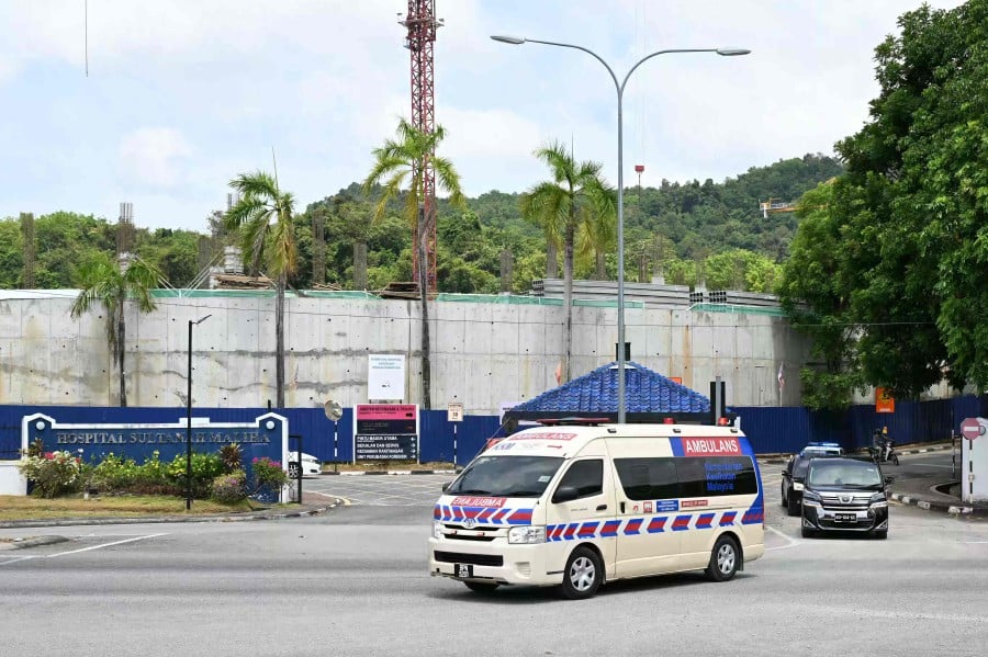 The convoy believed to carry Norway's King Harald V leaves Sultanah Maliha Hospital to Langkawi International Airport. -- AFP