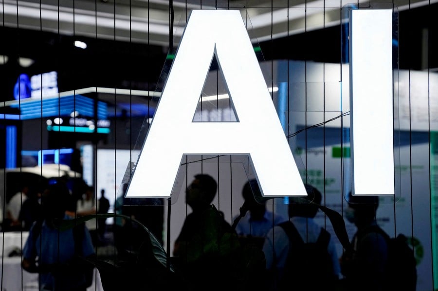FILE PHOTO: An AI (Artificial Intelligence) sign is seen at the World Artificial Intelligence Conference (WAIC) in Shanghai, China July 6, 2023. -- REUTERS