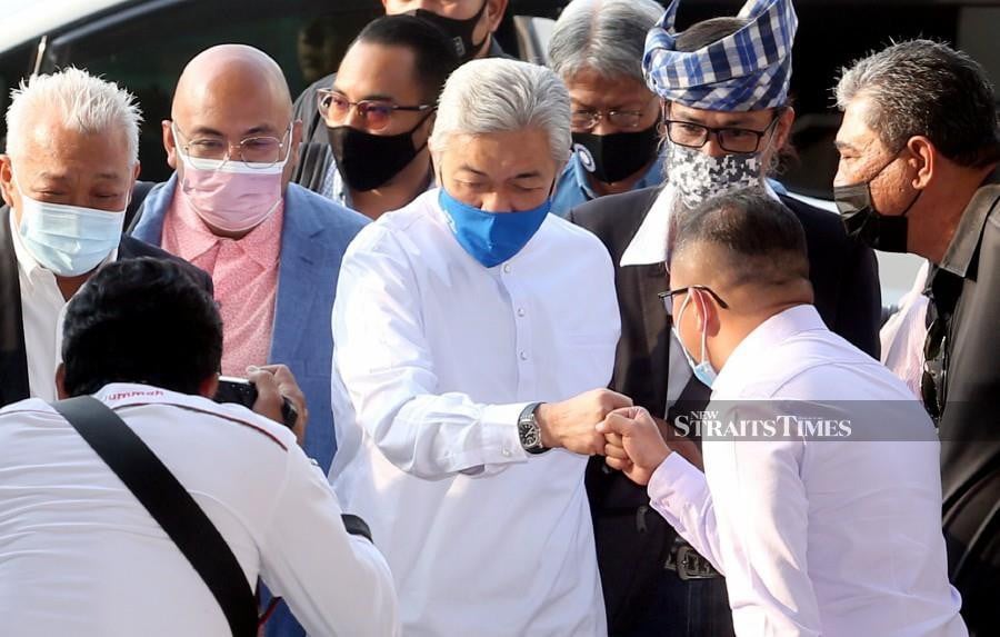 This file pic dated March 19, shows , Datuk Seri Dr Ahmad Zahid Hamidi arriving at the Kuala Lumpur Courts Complex ahead of his trial. - NSTP/HAIRUL ANUAR RAHIM