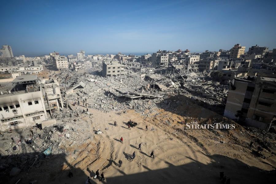 Palestinians inspect damages after Israeli forces withdrew from Gaza's Al Shifa Hospital and the area around it following a two-week operation, amid the ongoing conflict between Israel and Hamas, in Gaza City April 1, 2024. REUTERS pic