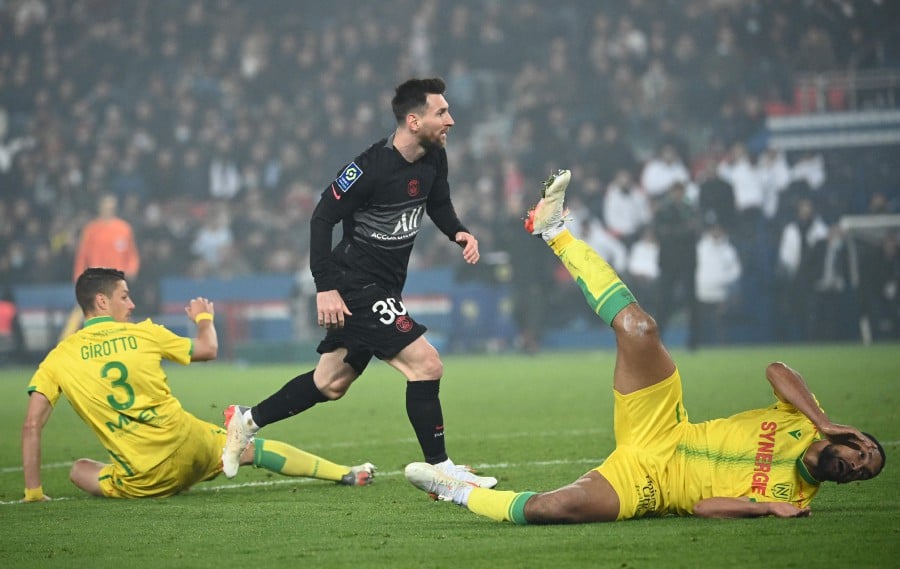 Paris Saint-Germain's Argentinian forward Lionel Messi celebrates after scoring a goal against Nantes at The Parc des Princes Stadium in Paris. - AFP PIC