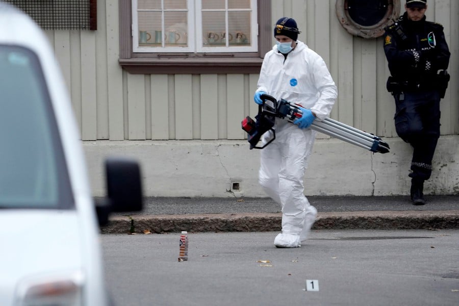  Police personnel continue to investigate after an attack in Kongsberg, Norway. - EPA PIC